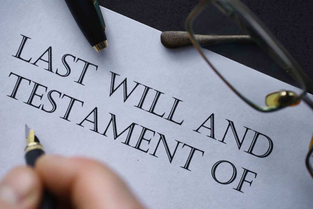 A handwritten document titled "Last Will and Testament" with a signature at the bottom.